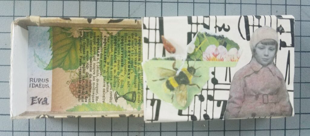 matchbox covered in treated paper and collage